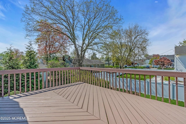 wooden deck featuring a residential view