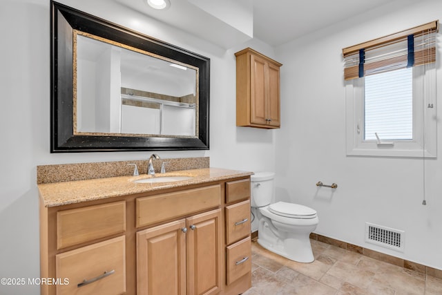 bathroom with toilet, visible vents, baseboards, and vanity