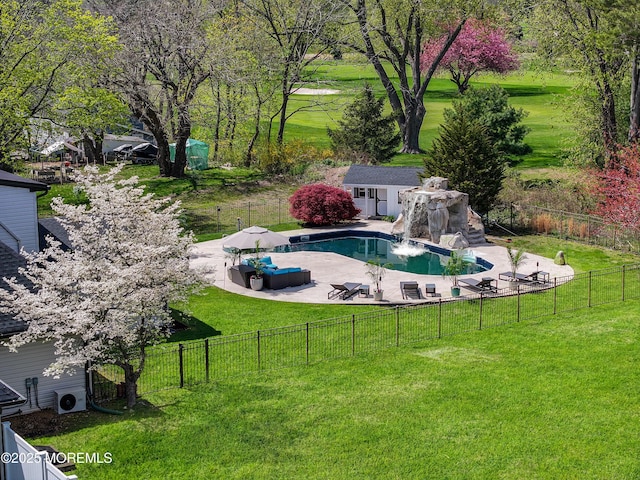 view of swimming pool featuring fence, a patio area, a fenced in pool, and a lawn