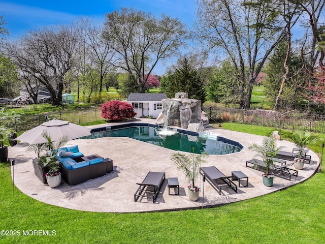 view of swimming pool with a fenced backyard and a yard