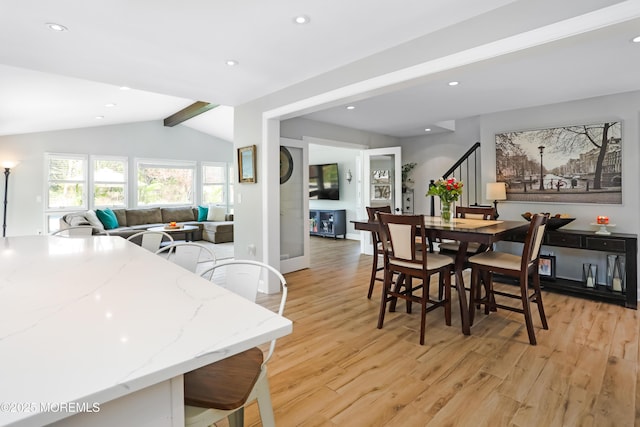 dining space featuring recessed lighting, stairway, vaulted ceiling with beams, and light wood-type flooring
