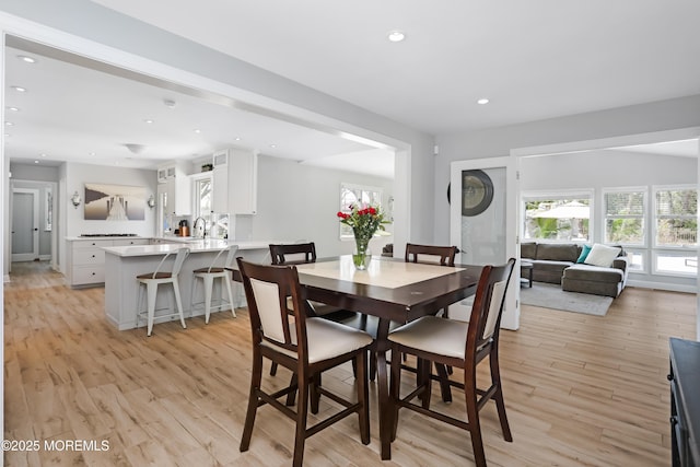 dining room featuring recessed lighting and light wood-type flooring