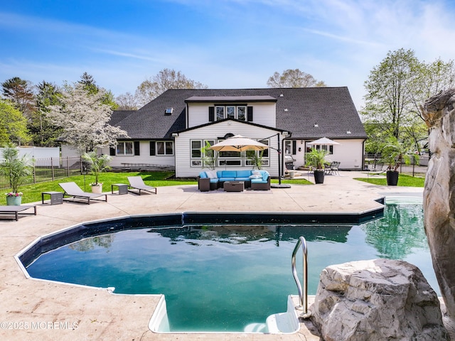 view of pool featuring a fenced in pool, outdoor lounge area, a patio, and fence