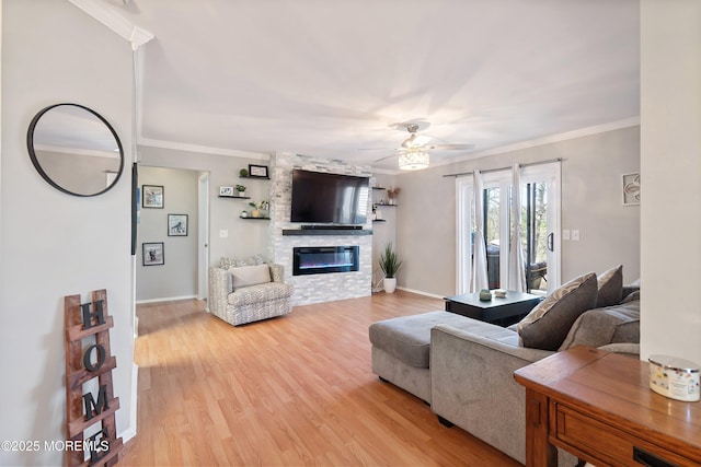 204 Begonia Ct, Jackson, NJ 08527 - living room with light wood-type flooring, a ceiling fan, a fireplace, and ornamental molding