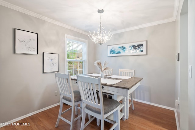 204 Begonia Ct, Jackson, NJ 08527 - dining space featuring wood finished floors, baseboards, ornamental molding, and an inviting chandelier