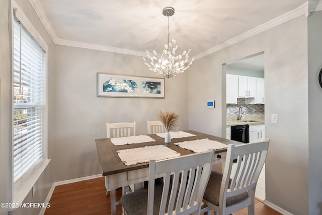 204 Begonia Ct, Jackson, NJ 08527 - dining area with wood finished floors, crown molding, baseboards, and an inviting chandelier