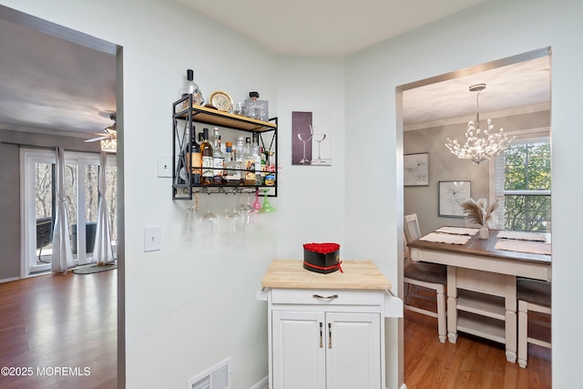 204 Begonia Ct, Jackson, NJ 08527 - interior space with a notable chandelier, wood finished floors, baseboards, ornamental molding, and visible vents