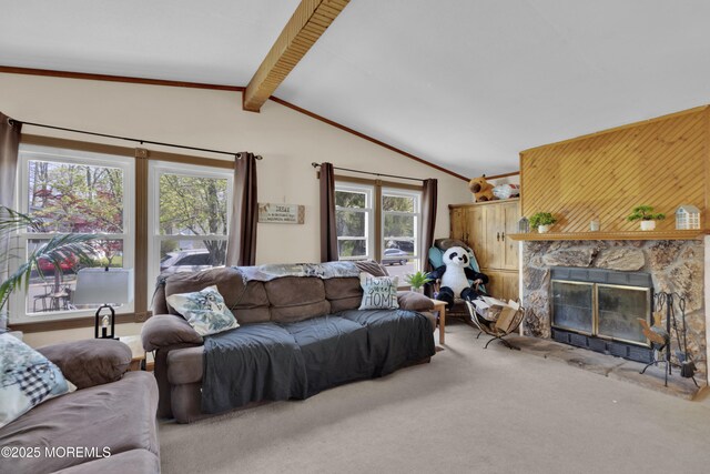 carpeted living area with vaulted ceiling with beams and a fireplace