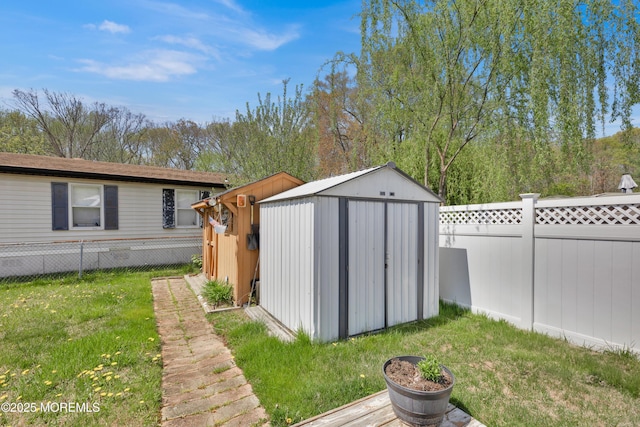view of shed with a fenced backyard