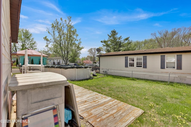 deck with fence and a yard