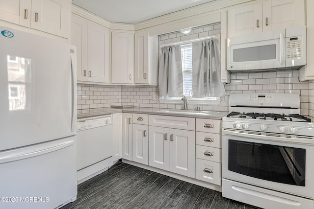 kitchen featuring white appliances, a sink, white cabinetry, light countertops, and tasteful backsplash