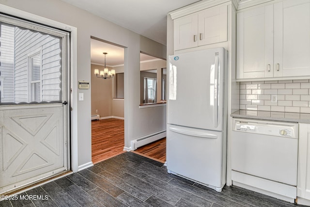 kitchen featuring white appliances, baseboard heating, a chandelier, white cabinetry, and dark wood-type flooring