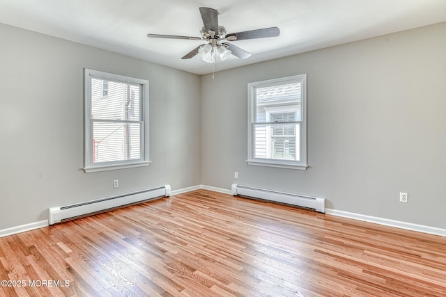 empty room with a baseboard heating unit, baseboard heating, light wood-type flooring, and ceiling fan