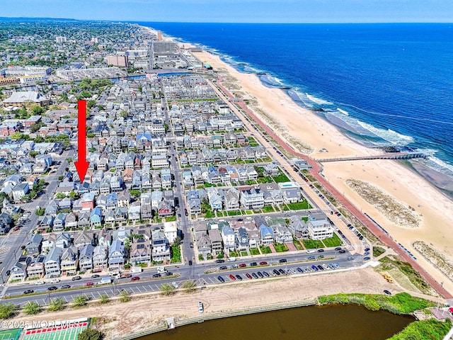 aerial view of property's location featuring unending shoreline