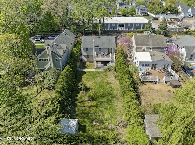birds eye view of property with a residential view
