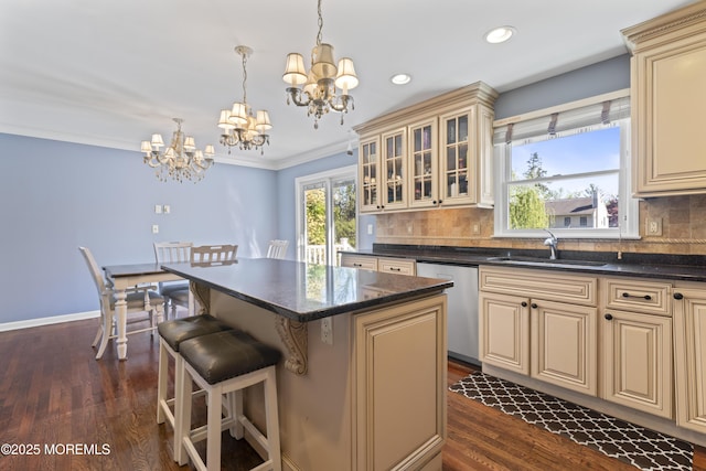 kitchen with stainless steel dishwasher and cream cabinetry