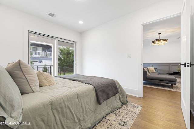 bedroom featuring a chandelier, visible vents, recessed lighting, and light wood-style floors