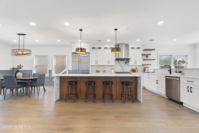 kitchen featuring a center island, open shelves, stainless steel appliances, backsplash, and wall chimney exhaust hood