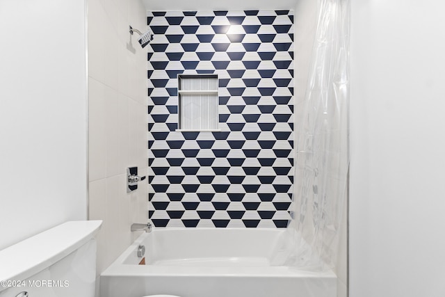 full bath featuring bathtub / shower combination and toilet