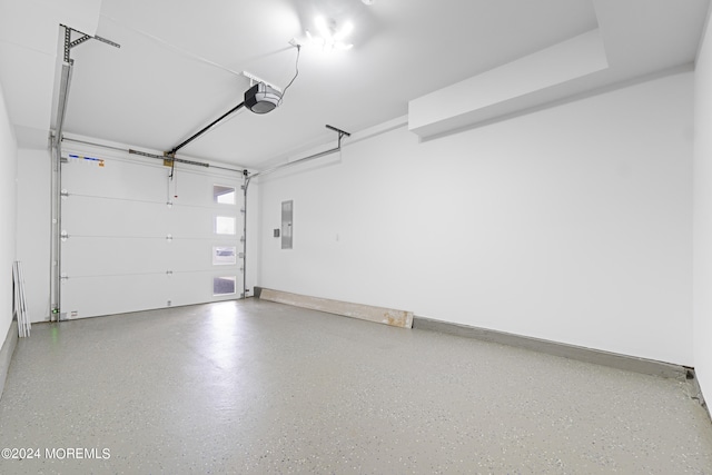 garage featuring a garage door opener and electric panel
