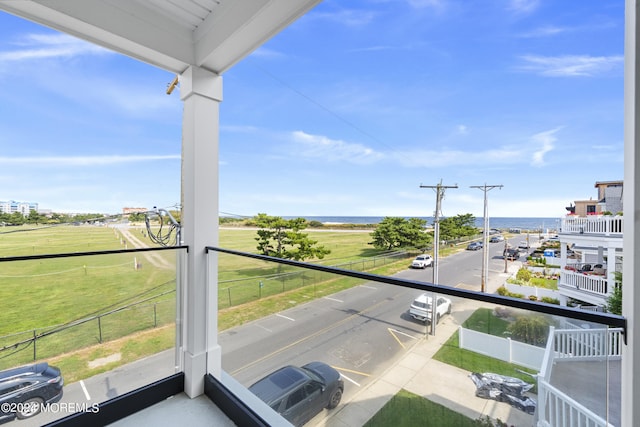 balcony featuring a water view