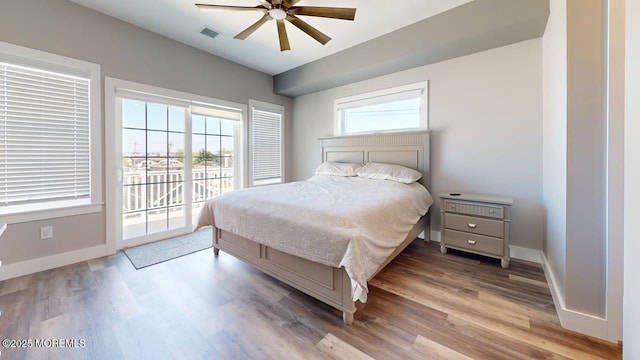 303 Webster Ave, Seaside Heights, NJ 08751 - bedroom featuring access to exterior, wood finished floors, baseboards, lofted ceiling, and ceiling fan