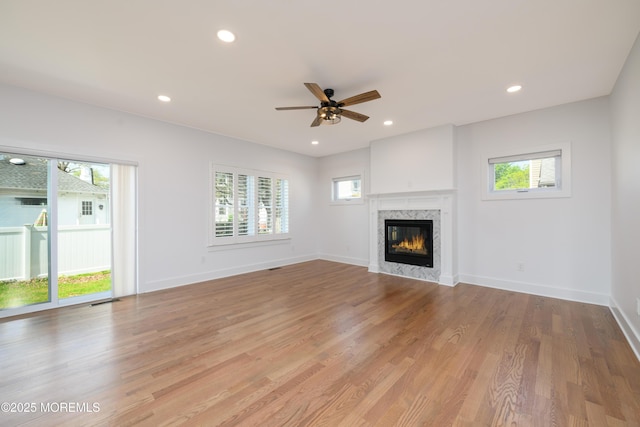 128 Church St, Keyport, NJ 07735 - unfurnished living room featuring a premium fireplace, ceiling fan, light wood-style flooring, and recessed lighting