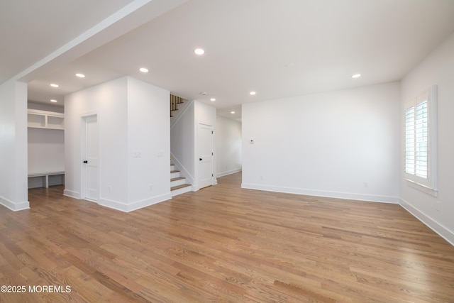 128 Church St, Keyport, NJ 07735 - unfurnished living room featuring stairs, light wood finished floors, and recessed lighting