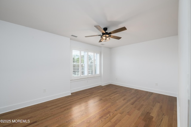 128 Church St, Keyport, NJ 07735 - empty room with ceiling fan and dark wood-style floors