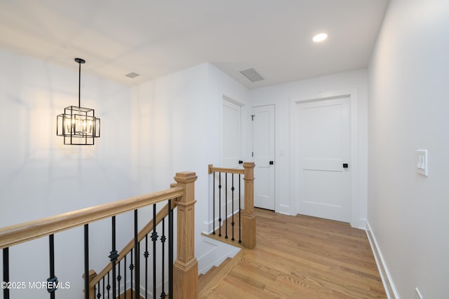 128 Church St, Keyport, NJ 07735 - hallway featuring an upstairs landing, light wood-type flooring, a chandelier, and recessed lighting