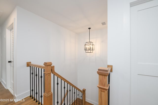 128 Church St, Keyport, NJ 07735 - staircase featuring wood finished floors and a chandelier
