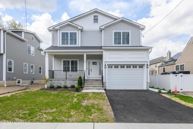 128 Church St, Keyport, NJ 07735 - view of front of home with a porch, driveway, and a garage