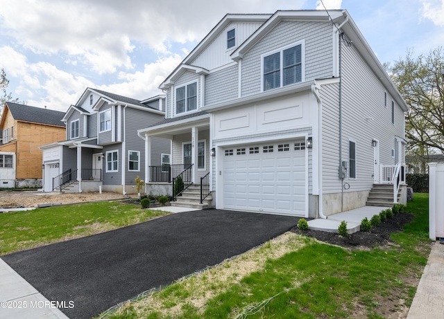 128 Church St, Keyport, NJ 07735 - view of front facade with asphalt driveway and an attached garage