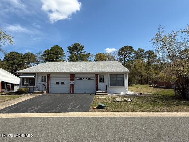 view of front of house featuring driveway and a garage