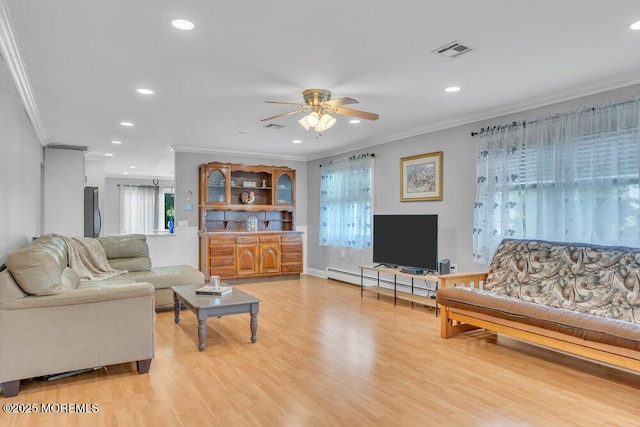 living room with crown molding, a ceiling fan, and recessed lighting