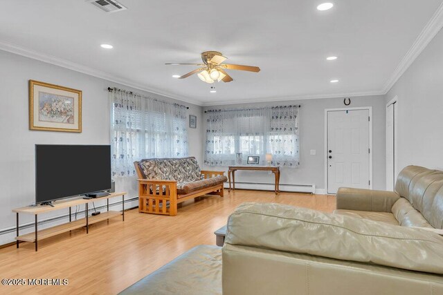 living area with visible vents, ornamental molding, ceiling fan, recessed lighting, and a baseboard heating unit