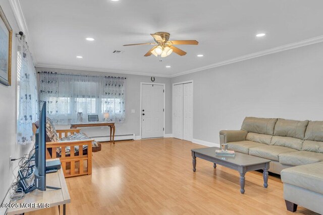 living area featuring crown molding, light wood-type flooring, a ceiling fan, and a baseboard heating unit