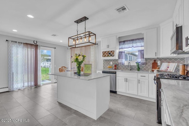 kitchen with visible vents, recessed lighting, white cabinetry, tasteful backsplash, and stainless steel appliances