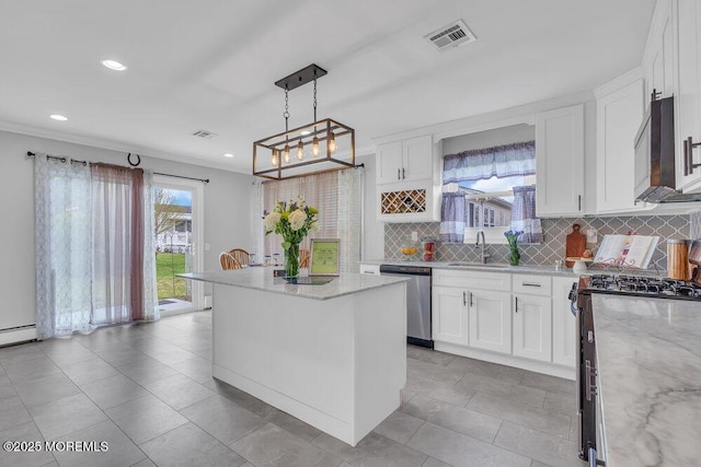 kitchen featuring visible vents, decorative backsplash, recessed lighting, white cabinetry, and stainless steel appliances