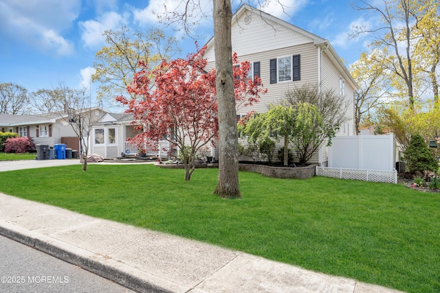 1915 Red Cedar St, Toms River, NJ 08753 - view of front of house featuring fence and a front yard