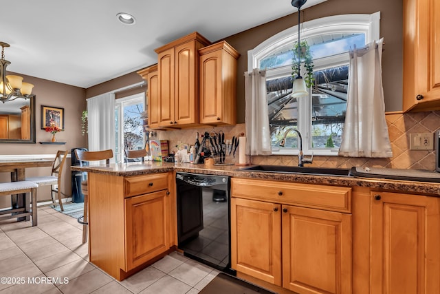 1915 Red Cedar St, Toms River, NJ 08753 - kitchen featuring black dishwasher, a sink, tasteful backsplash, and a healthy amount of sunlight