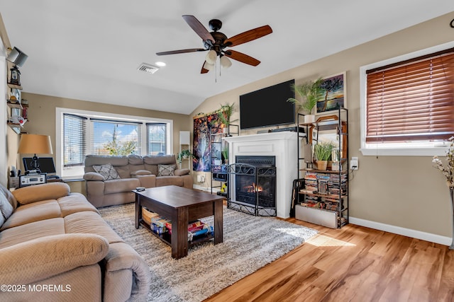1915 Red Cedar St, Toms River, NJ 08753 - living area featuring a fireplace with flush hearth, a ceiling fan, visible vents, baseboards, and wood finished floors