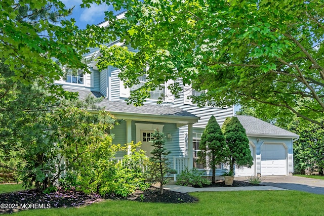 44 Sacramento Way, Tinton Falls, NJ 07712 - view of property hidden behind natural elements featuring driveway and roof with shingles