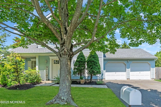 44 Sacramento Way, Tinton Falls, NJ 07712 - view of property hidden behind natural elements with asphalt driveway, a front lawn, and a shingled roof