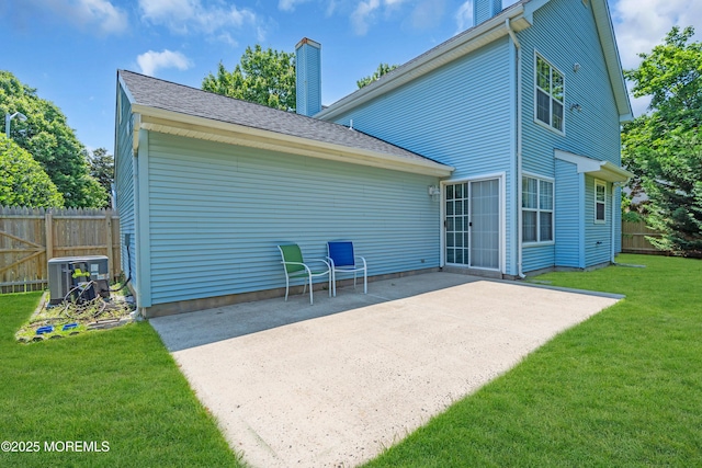 44 Sacramento Way, Tinton Falls, NJ 07712 - back of property featuring a chimney and a patio area