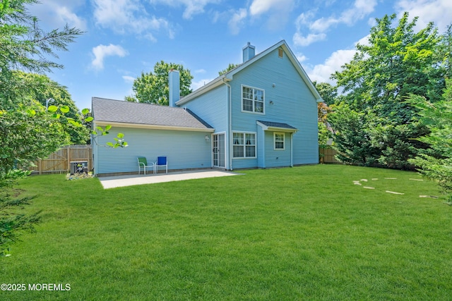 44 Sacramento Way, Tinton Falls, NJ 07712 - rear view of house featuring a chimney and a patio