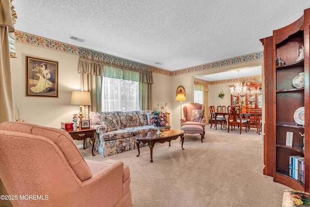 44 Sacramento Way, Tinton Falls, NJ 07712 - living room with carpet flooring, a chandelier, and a textured ceiling