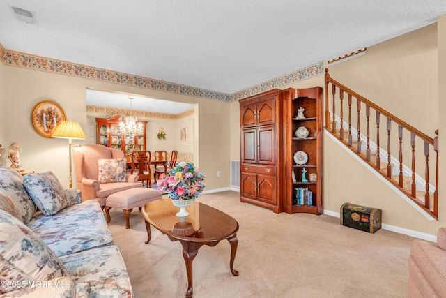 44 Sacramento Way, Tinton Falls, NJ 07712 - living room featuring a chandelier, stairway, and light colored carpet