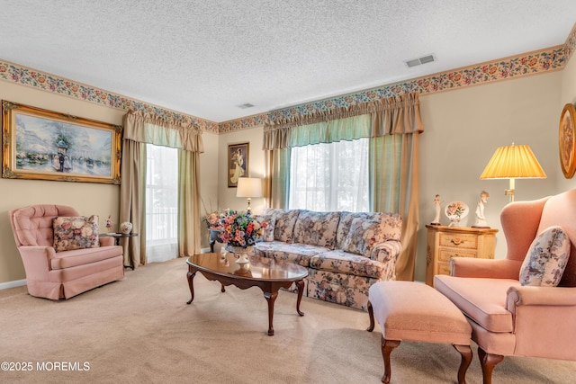 44 Sacramento Way, Tinton Falls, NJ 07712 - carpeted living room with healthy amount of natural light and a textured ceiling
