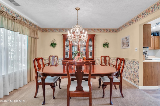 44 Sacramento Way, Tinton Falls, NJ 07712 - dining space with a textured ceiling, wainscoting, a chandelier, and light colored carpet